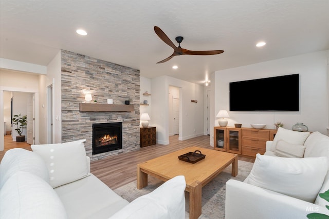 6009 W Riva Capri St, Meridian, ID 83646 - living room with recessed lighting, a ceiling fan, light wood-style floors, and a fireplace