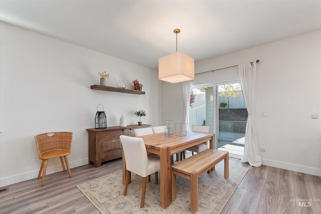 6009 W Riva Capri St, Meridian, ID 83646 - dining space featuring light wood-style flooring and baseboards