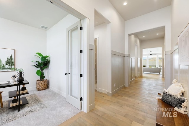 hall with light wood-type flooring