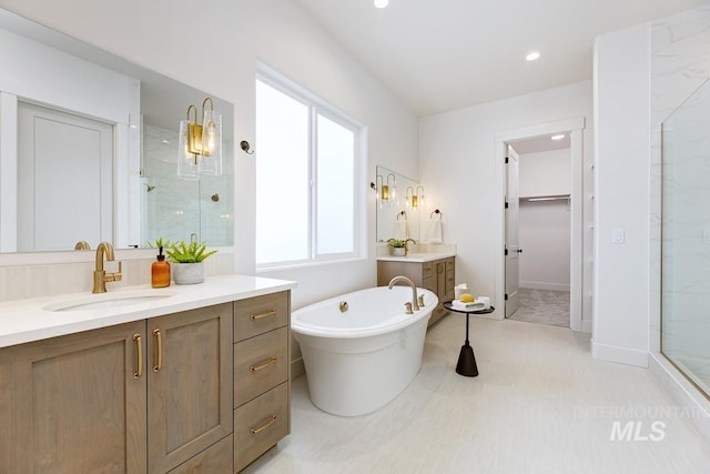 bathroom featuring independent shower and bath and vanity