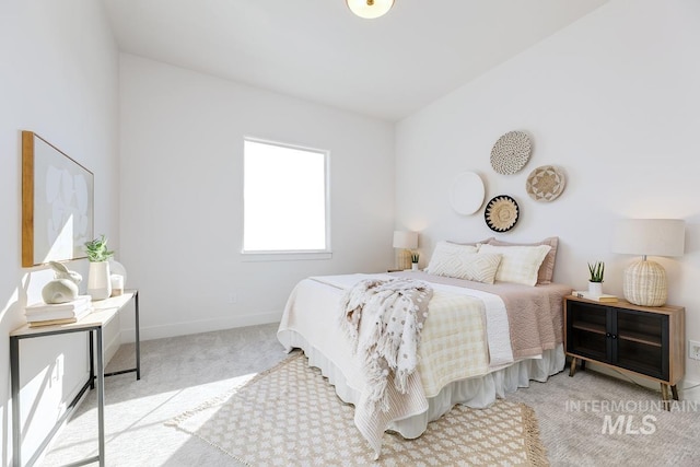 bedroom with light colored carpet