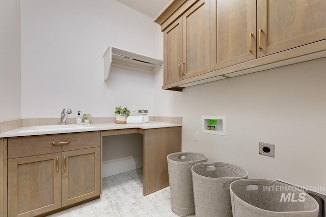 clothes washing area featuring washer hookup, hookup for an electric dryer, cabinets, and sink