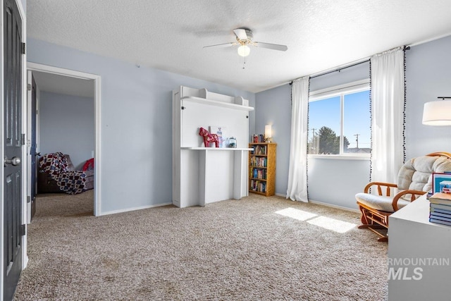 16042 N Saint Helens Dr, Nampa, ID 83651 - living area featuring ceiling fan, baseboards, a textured ceiling, and carpet