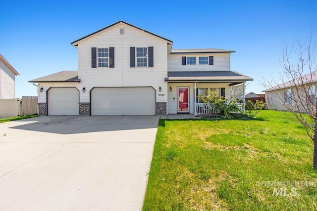 16042 N Saint Helens Dr, Nampa, ID 83651 - traditional-style home with concrete driveway, a front lawn, fence, a porch, and a garage