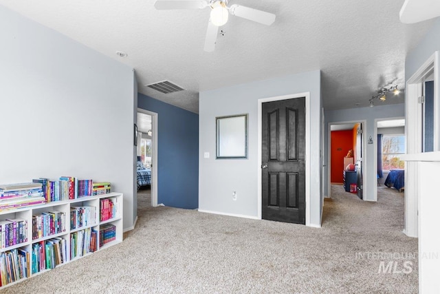 16042 N Saint Helens Dr, Nampa, ID 83651 - interior space with a wealth of natural light, a ceiling fan, visible vents, and carpet