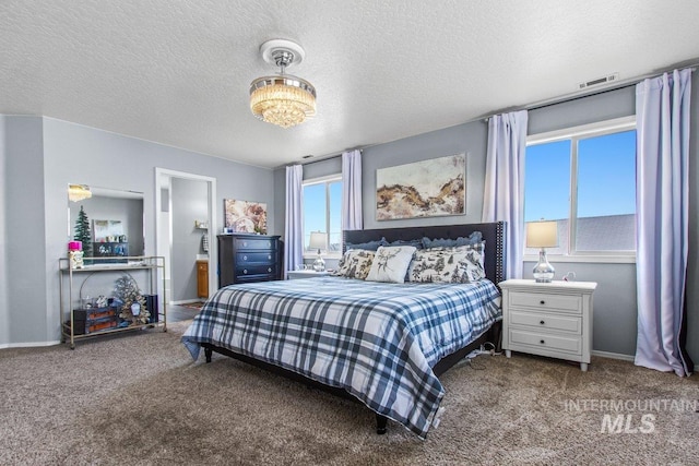 16042 N Saint Helens Dr, Nampa, ID 83651 - carpeted bedroom featuring a textured ceiling, visible vents, and baseboards
