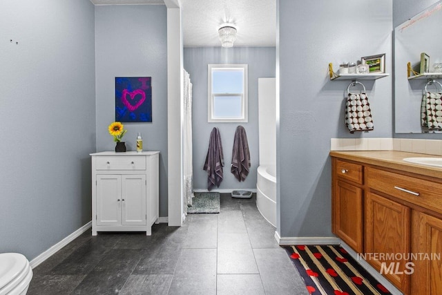 16042 N Saint Helens Dr, Nampa, ID 83651 - bathroom with baseboards, a washtub, vanity, and a shower with curtain