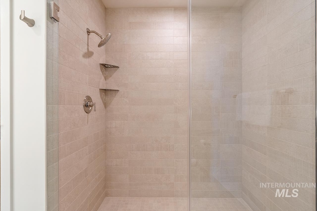 bathroom with tiled shower