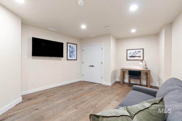 living room with light hardwood / wood-style flooring