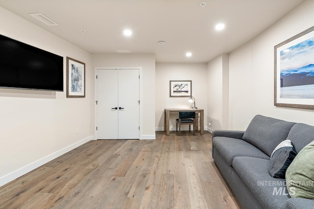 living room with light hardwood / wood-style flooring