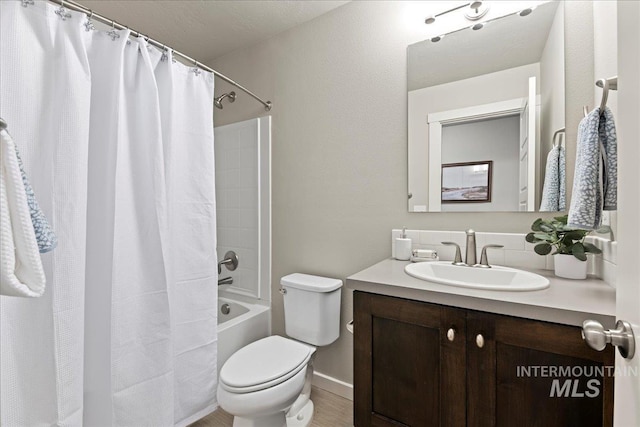 full bathroom with shower / tub combo, vanity, and toilet