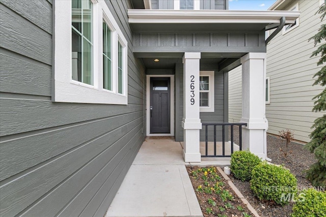 property entrance featuring covered porch