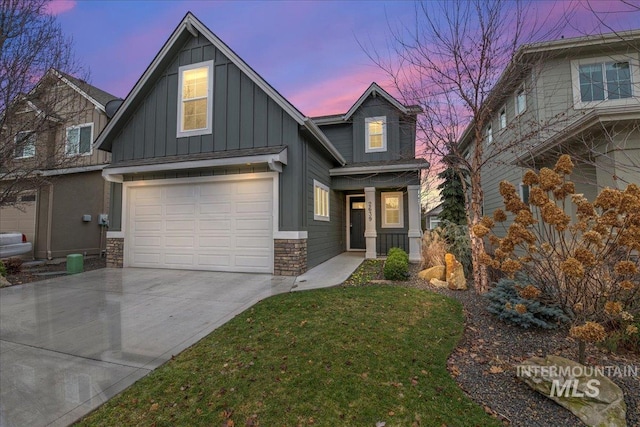 craftsman-style house with a yard and a garage