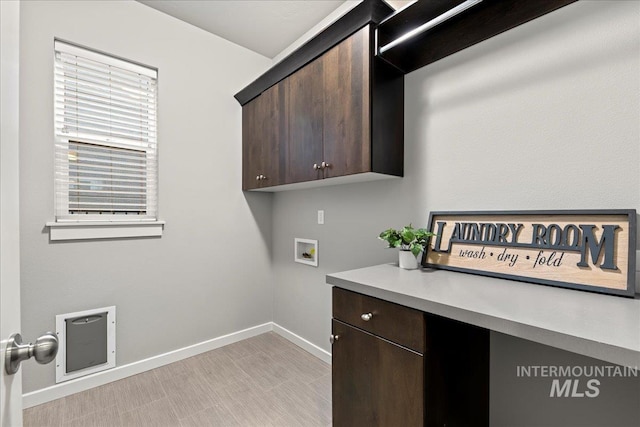 laundry room with cabinets and hookup for a washing machine