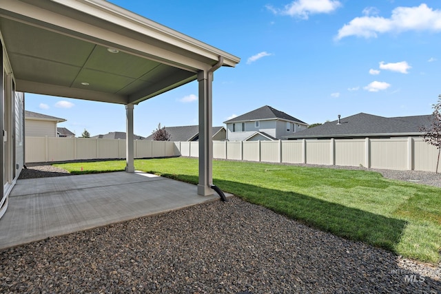 view of yard featuring a fenced backyard and a patio