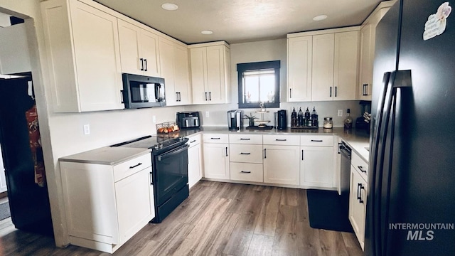 4 N 1050 E, Declo, ID 83323 - kitchen featuring black appliances, wood finished floors, white cabinets, and recessed lighting