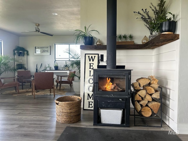 4 N 1050 E, Declo, ID 83323 - detailed view of wood finished floors, a wood stove, and a ceiling fan