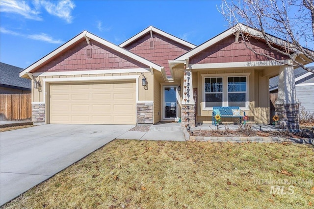 craftsman inspired home with an attached garage, fence, a front lawn, and concrete driveway