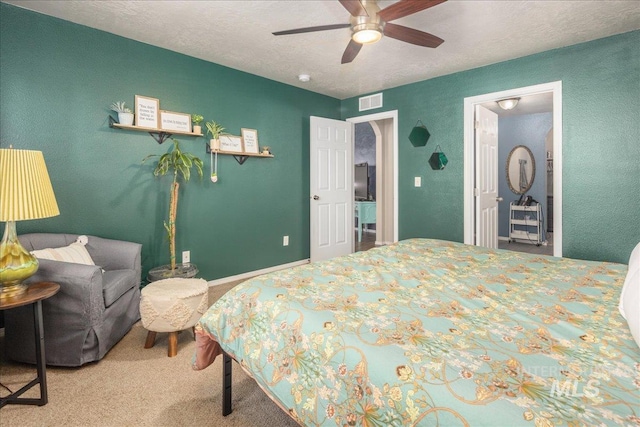 bedroom with carpet floors, baseboards, a ceiling fan, and a textured ceiling