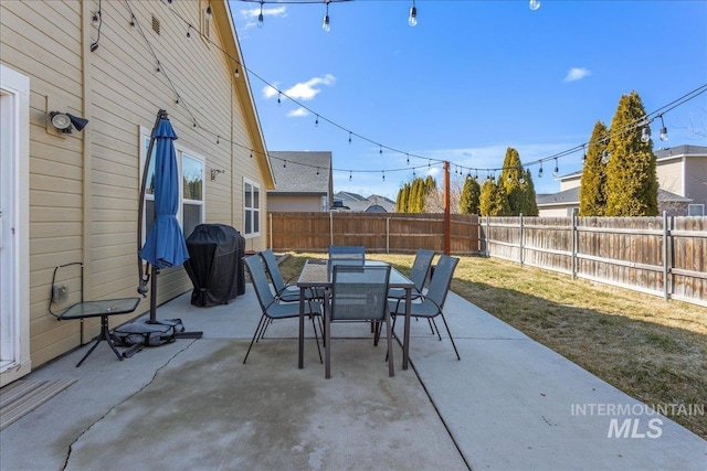 view of patio / terrace featuring a fenced backyard, area for grilling, and outdoor dining space