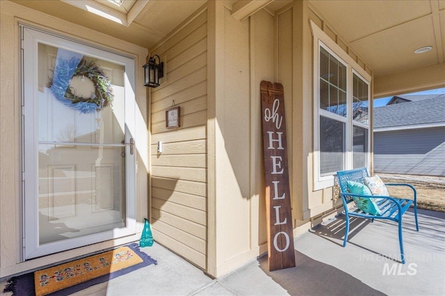 property entrance with covered porch