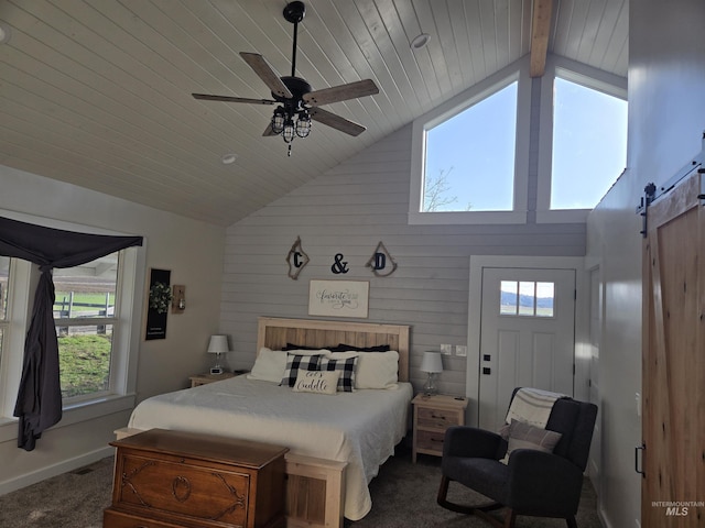 bedroom with dark colored carpet, high vaulted ceiling, a barn door, and multiple windows