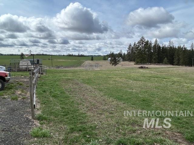 view of yard with a rural view