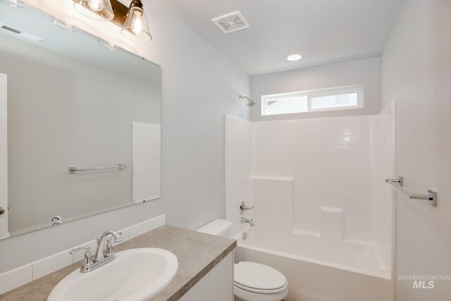 full bathroom with bathtub / shower combination, toilet, and vanity