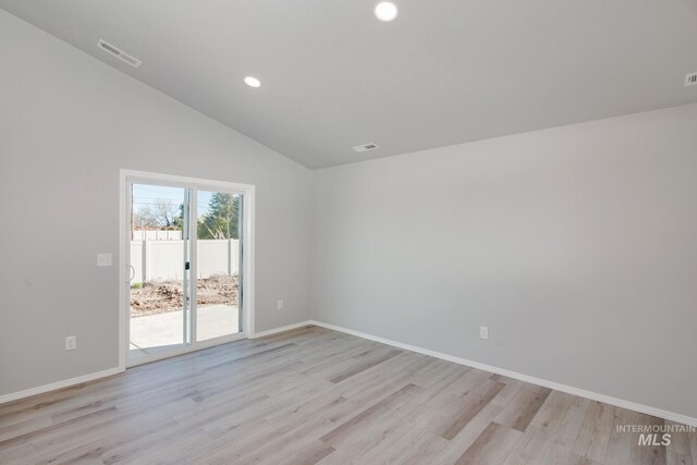 unfurnished room featuring high vaulted ceiling and light wood-type flooring