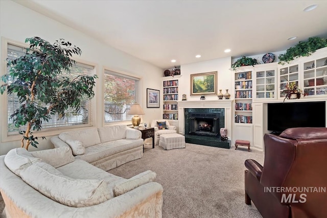 carpeted living room with a fireplace