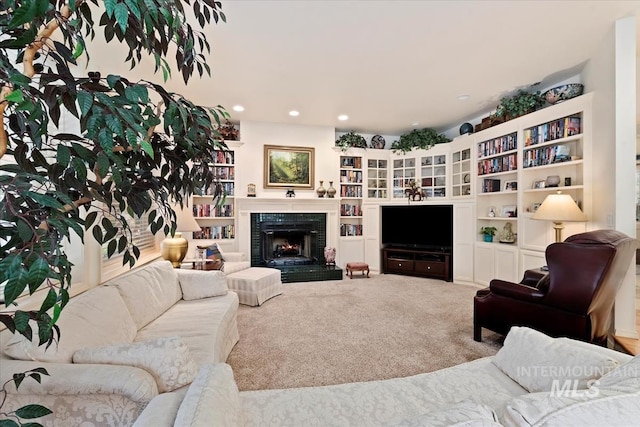 carpeted living room featuring built in features