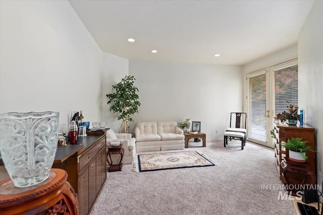 living room with light carpet and french doors