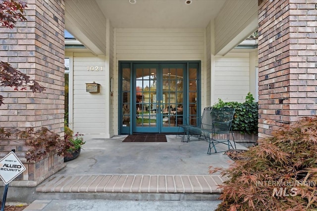 doorway to property featuring french doors