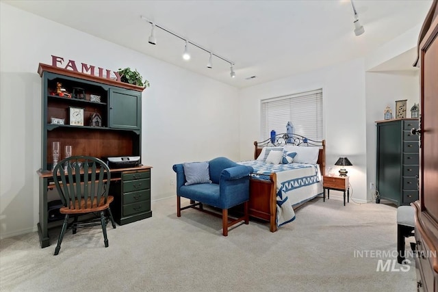 bedroom featuring light colored carpet