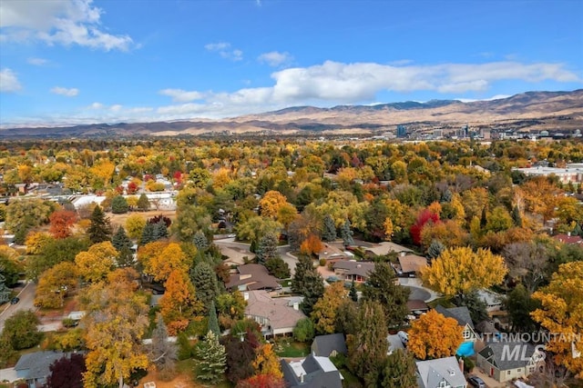 birds eye view of property with a mountain view