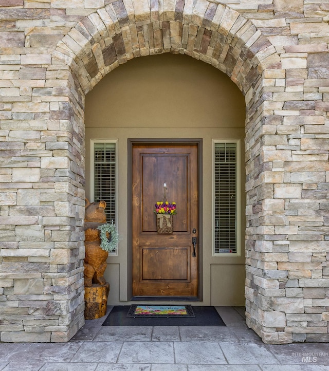 1573 E Commander St, Meridian, ID 83646 - view of exterior entry with stone siding and stucco siding