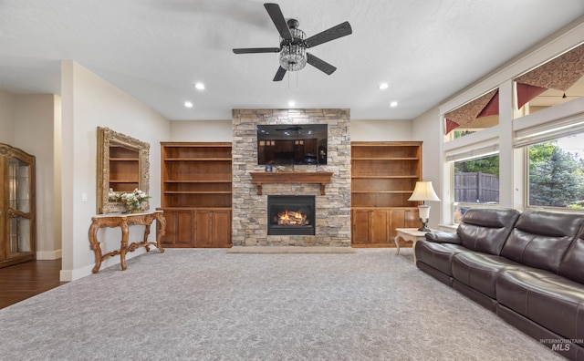 1573 E Commander St, Meridian, ID 83646 - carpeted living room featuring a ceiling fan, a fireplace, recessed lighting, and baseboards