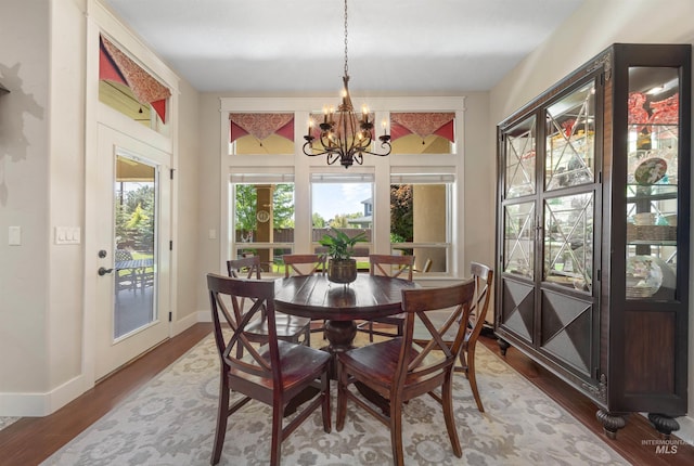 1573 E Commander St, Meridian, ID 83646 - dining space with a chandelier, wood finished floors, and baseboards