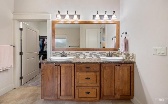 1573 E Commander St, Meridian, ID 83646 - bathroom with double vanity, backsplash, baseboards, and a spacious closet