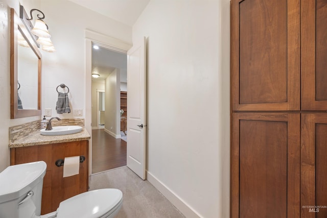 1573 E Commander St, Meridian, ID 83646 - half bathroom featuring toilet, vanity, and baseboards