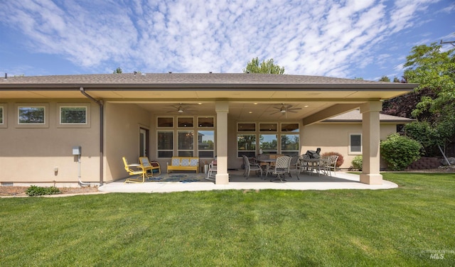 1573 E Commander St, Meridian, ID 83646 - rear view of property with a ceiling fan, stucco siding, a lawn, and a patio