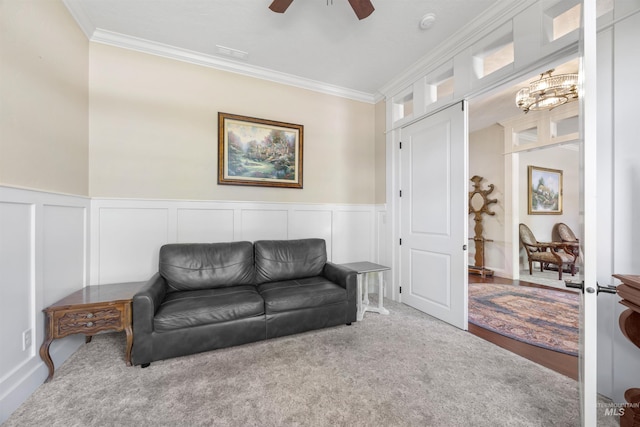 1573 E Commander St, Meridian, ID 83646 - living area featuring ornamental molding, a ceiling fan, a decorative wall, wainscoting, and a chandelier