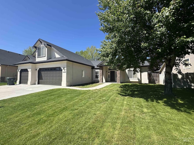 3669 N Dixon Ave, Meridian, ID 83646 - view of front of house featuring a garage, driveway, and stone siding