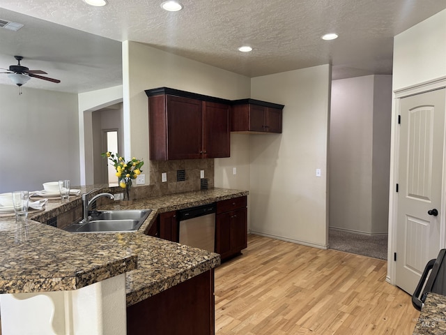 3669 N Dixon Ave, Meridian, ID 83646 - kitchen with a ceiling fan, a peninsula, light wood-style flooring, a sink, and dishwasher