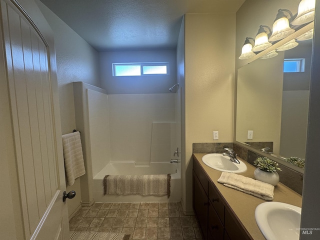 3669 N Dixon Ave, Meridian, ID 83646 - full bathroom with double vanity, shower / bath combination, and a textured ceiling