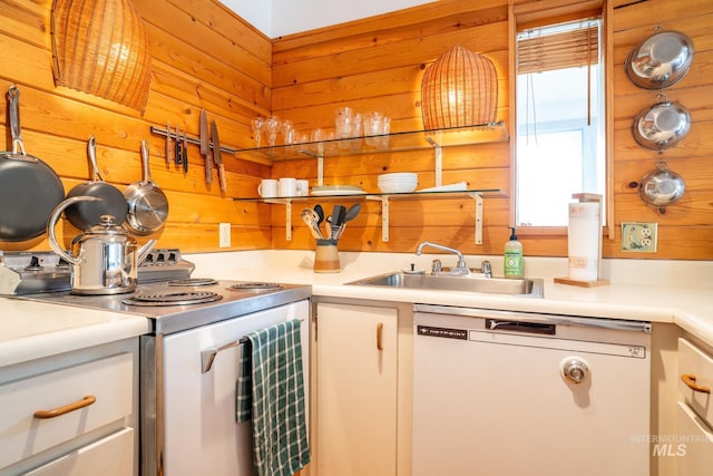 260 S 2nd Ave Unit 51, Ketchum, ID 83340 - kitchen with a sink, electric range, wood walls, light countertops, and white dishwasher