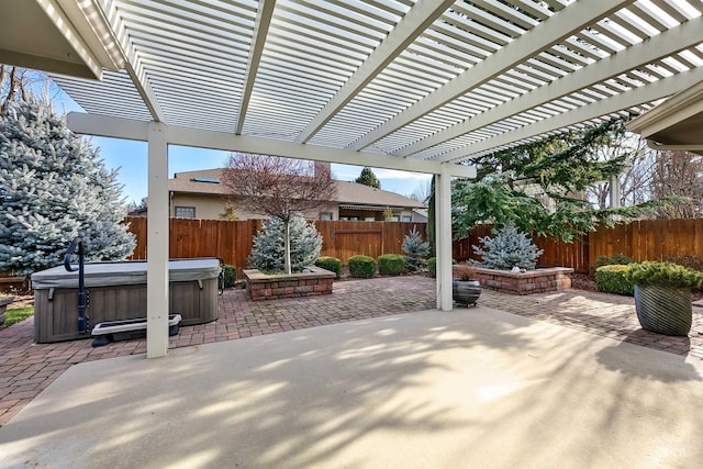 view of patio / terrace featuring a pergola and a hot tub