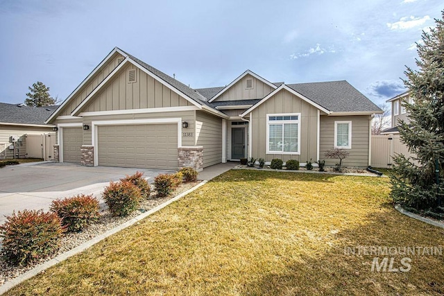 craftsman house with board and batten siding, a front yard, fence, and driveway