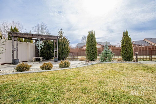 view of yard featuring a patio area, fence, and a pergola