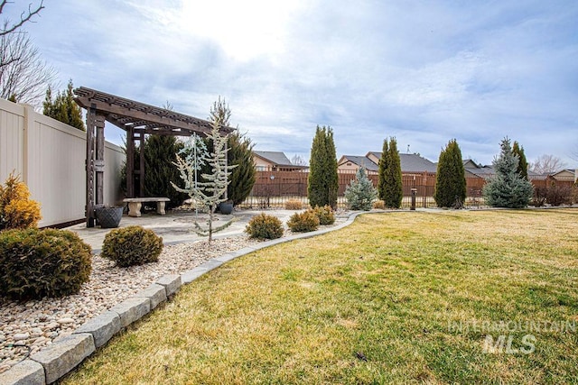 view of yard featuring a fenced backyard, a patio, and a pergola